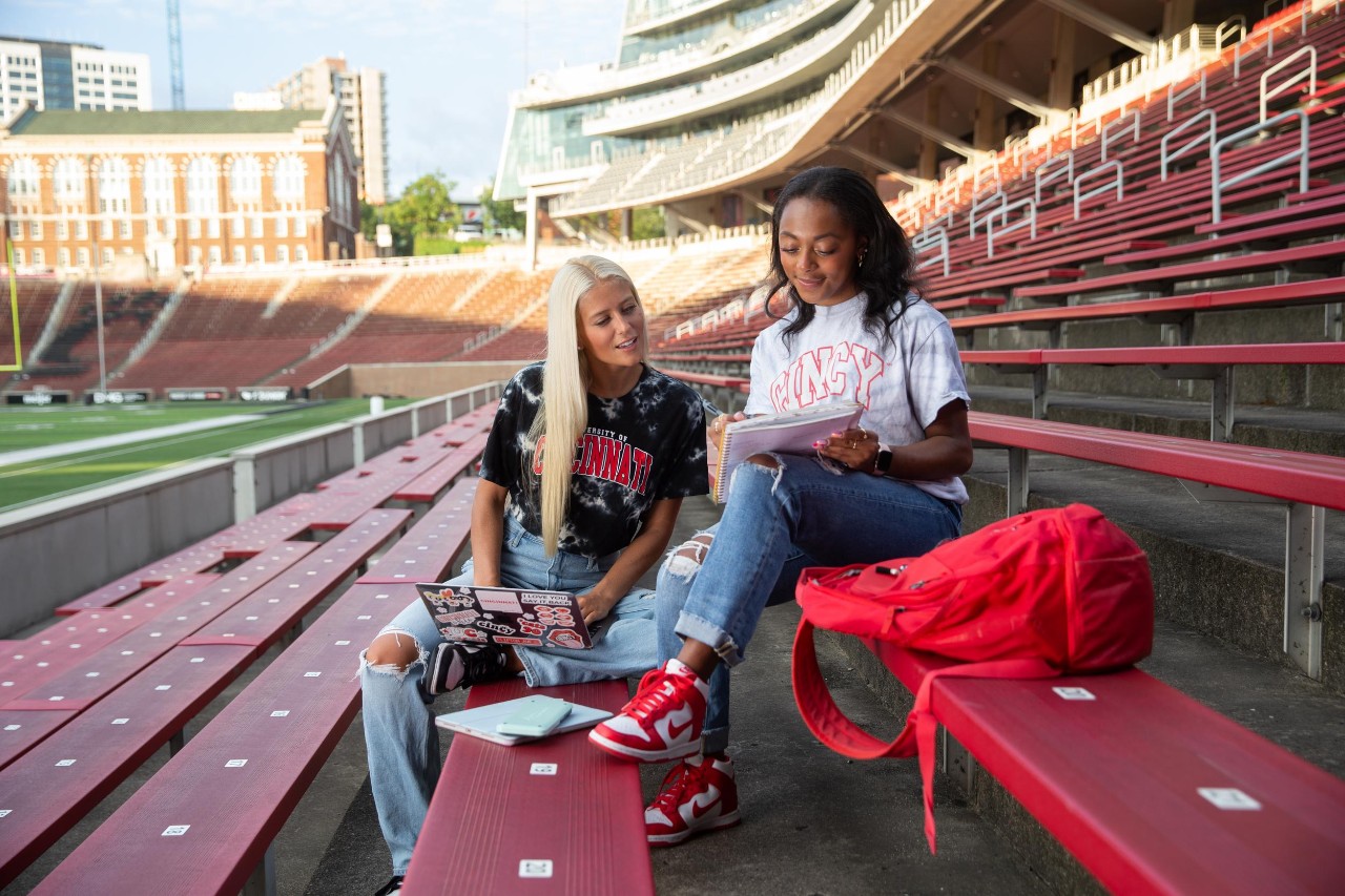 students studying in Nippert Stadium