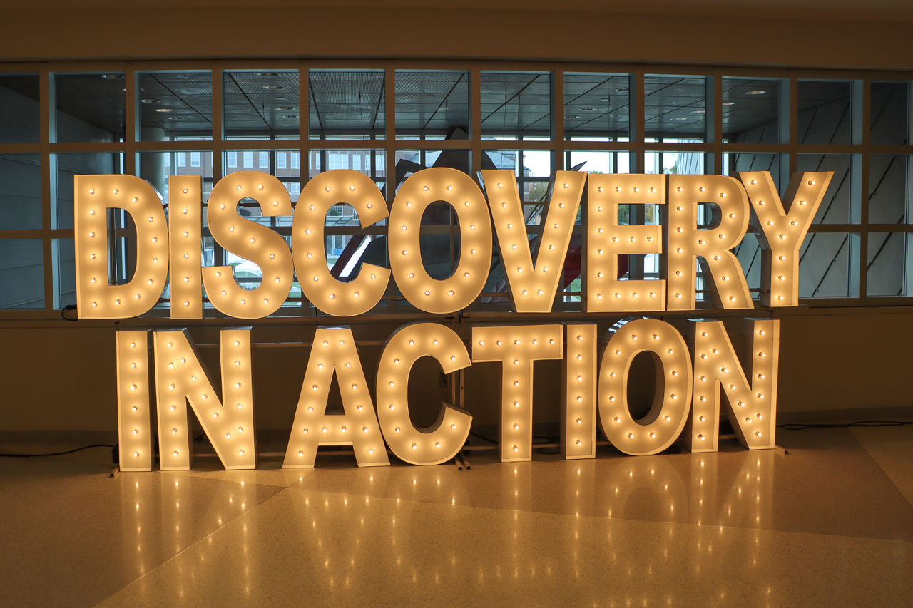 "Discovery in Action" lighted- letter display at the showcase.