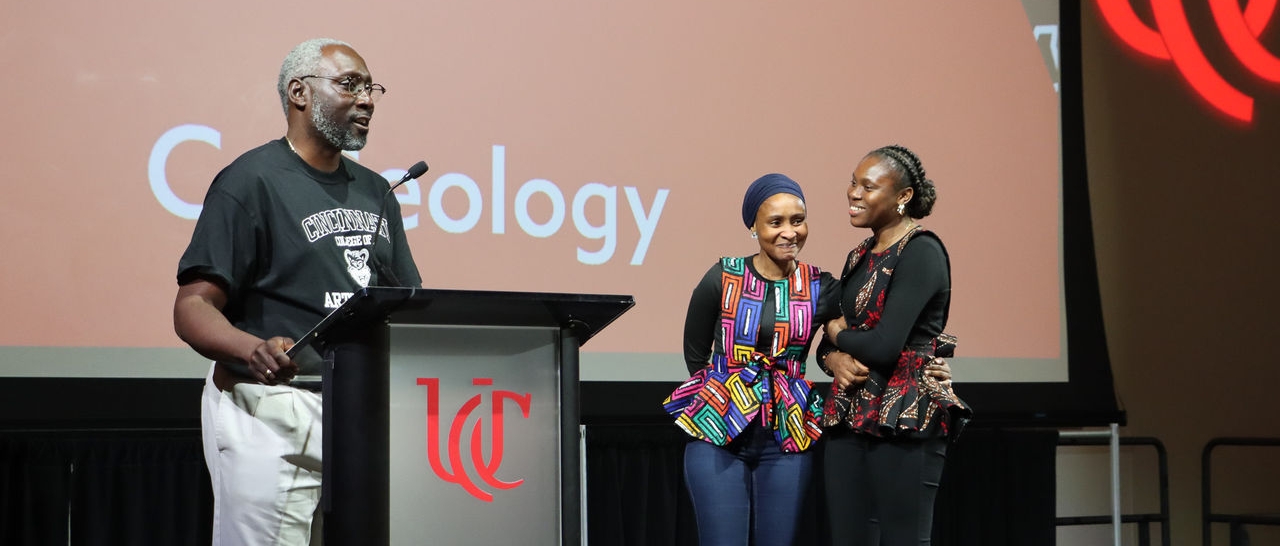 Students winners of the competition on stage with Dean Mack.