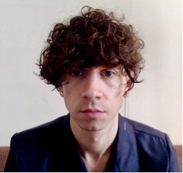 Portrait headshot of Ærin Espinosa 