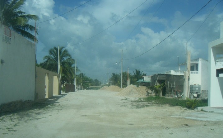 image of a sandy road and buildings in the yucatan