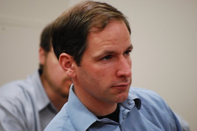 Audience member listening to speaker