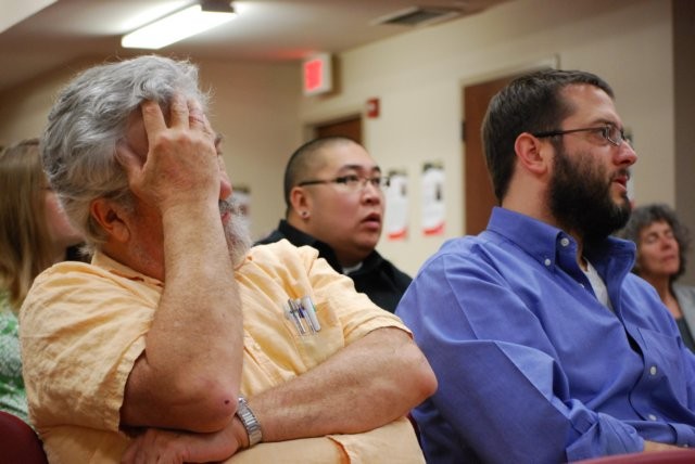 Audience member listening to speaker