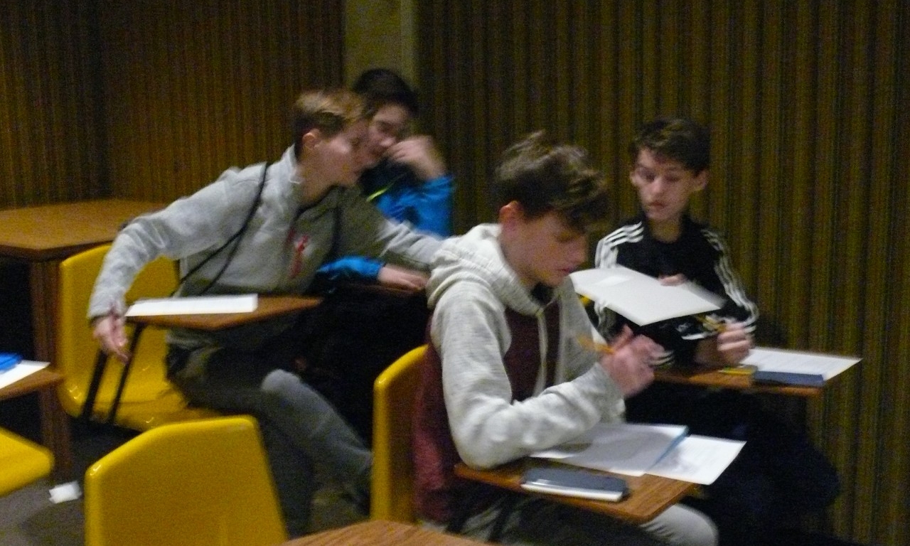 Math Bowl 2018 students working in a lecture hall