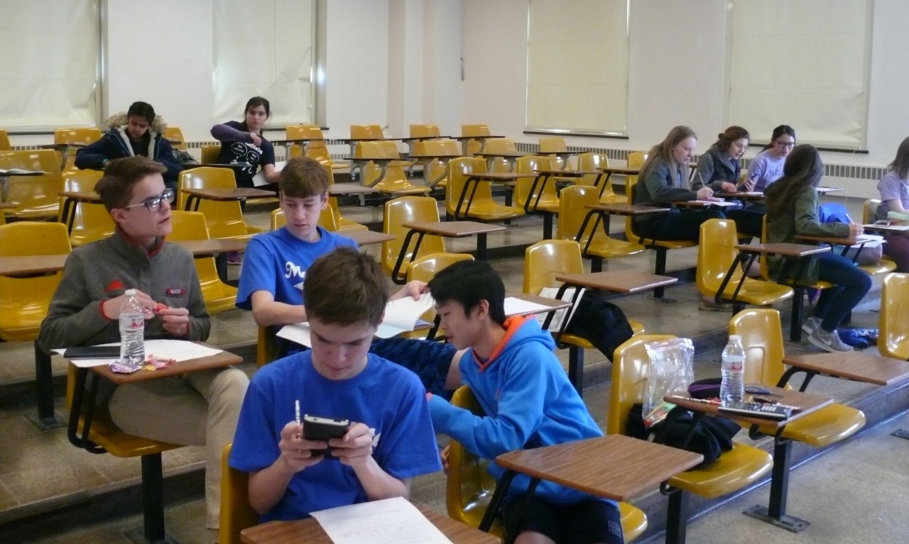 Math Bowl 2018 students working in a lecture hall