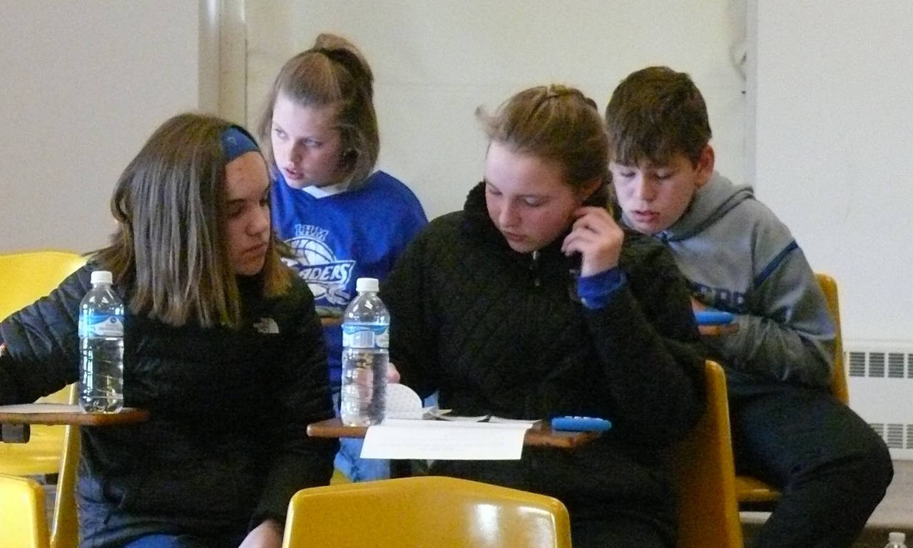 Math Bowl 2018 students working in a lecture hall