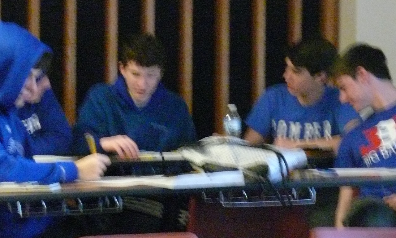 Math Bowl 2018 students working a grouped desks