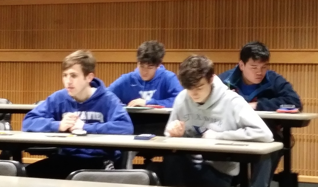 Math Bowl 2019 students working in a lecture hall