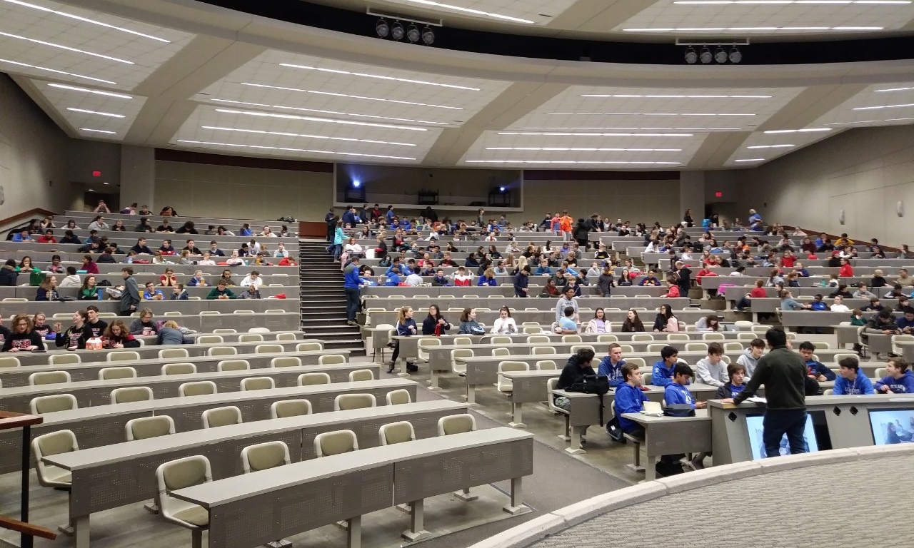 Math Bowl 2019 students working in a lecture hall
