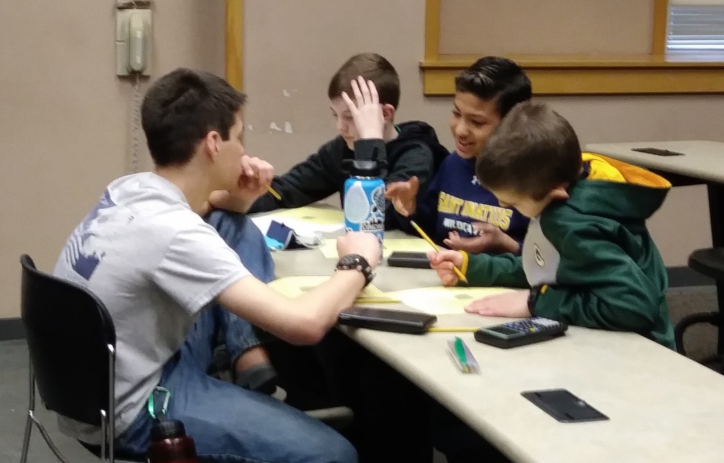 Math Bowl 2019 students working in a lecture hall