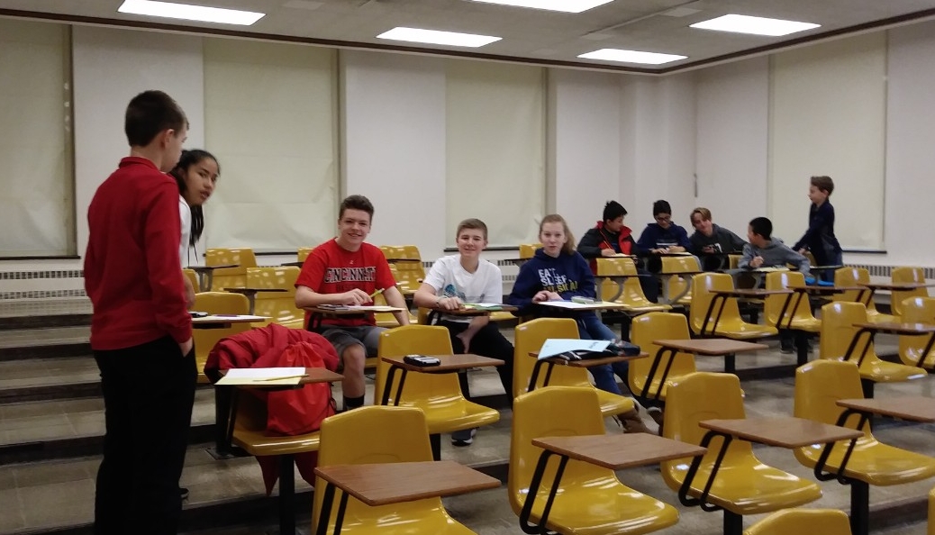 Math Bowl 2019 students working in a lecture hall