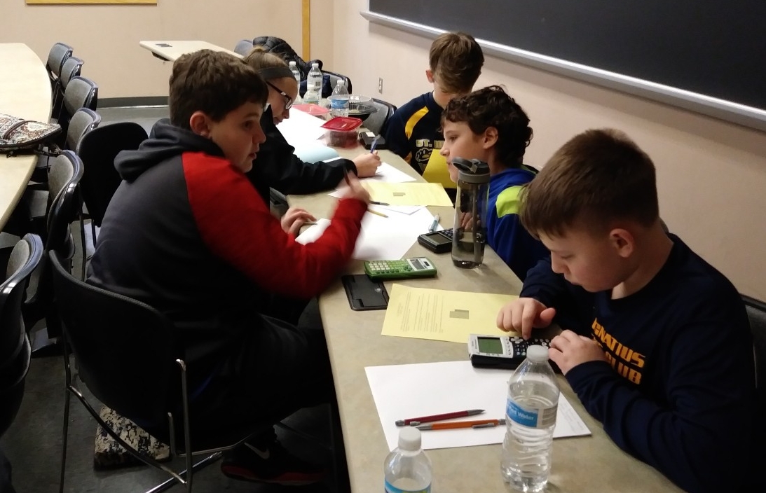Math Bowl 2019 students working in a lecture hall