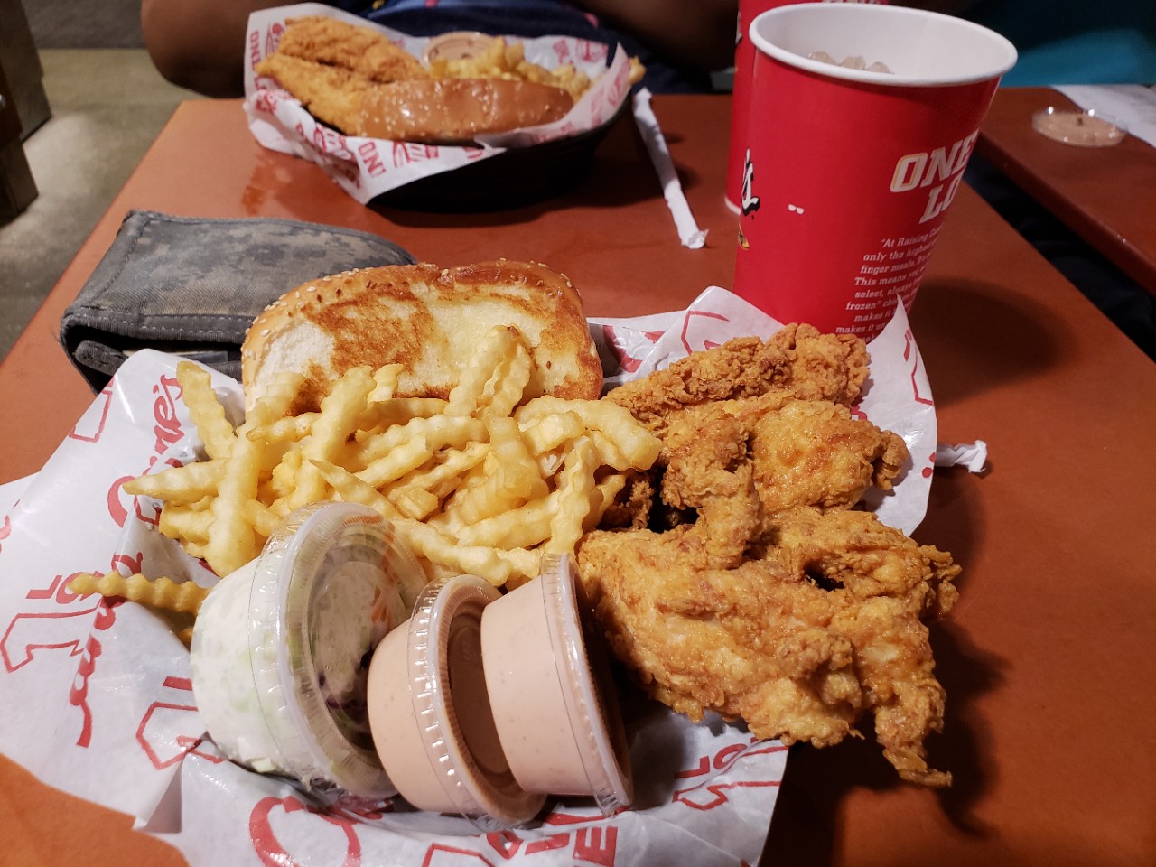 Picture of Raising Cain's Box Combo, including chicken strips and their special sauce