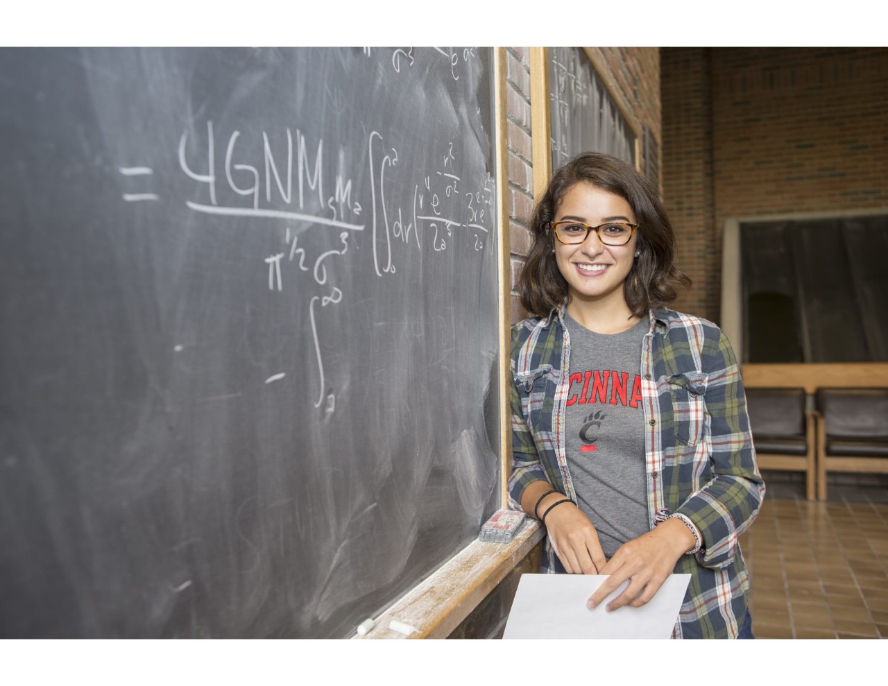 Photo of Leembruggen standing next to a chalkboard 
