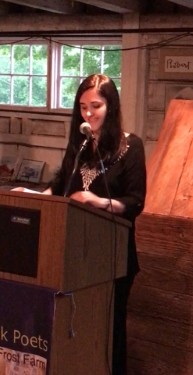 Photograph of Doyle reading her work at the Frost Farm Poetry Conference.
