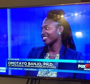 Screen capture of Professor Banjo discussing her work on a local TV news show.