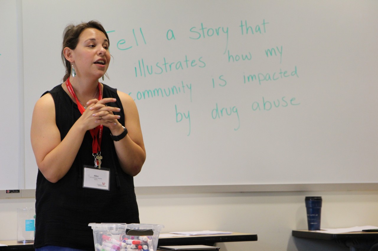 A UC graduate student leads students in a story-telling activity.