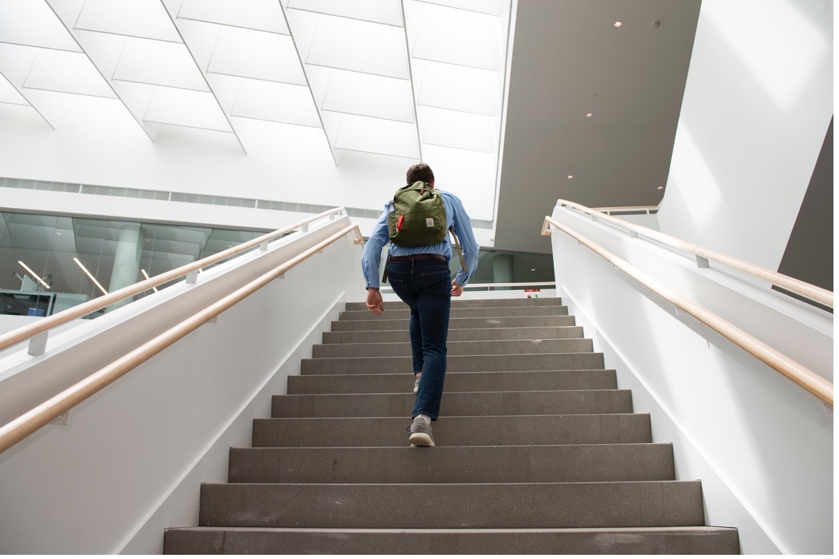 Student climbing the stairs