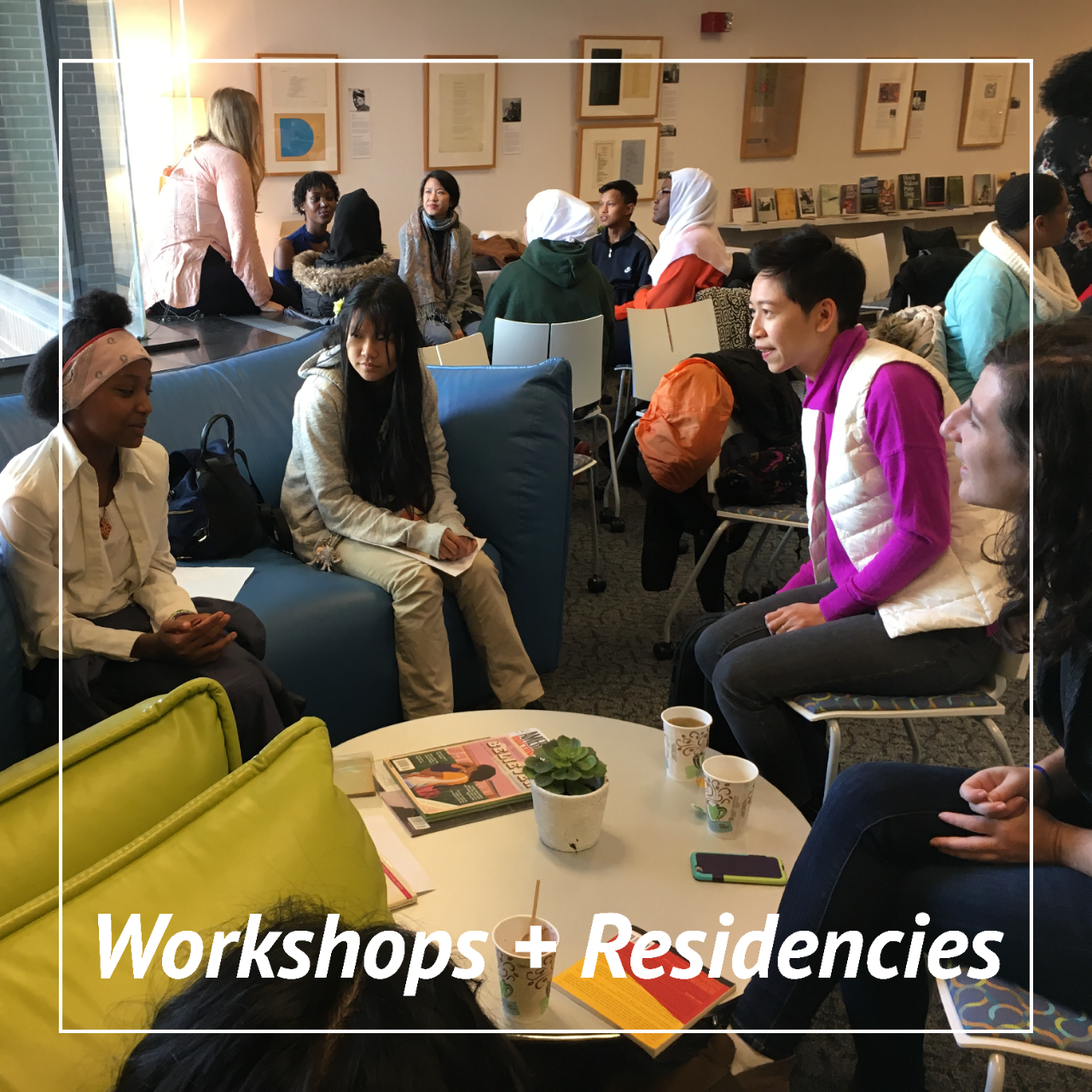 A group of young writers in workshop with a Grad UC Poet