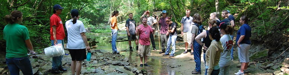 Group of students standing in creek